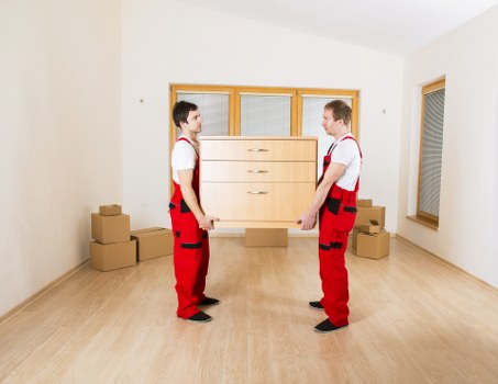 Professional movers carrying furniture during an Earlscourt relocation